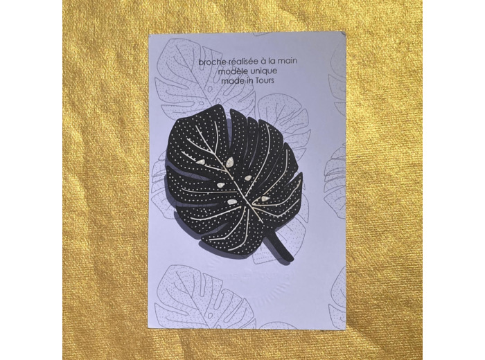 Broche monstera fond noir dessin blanc pailleté argent