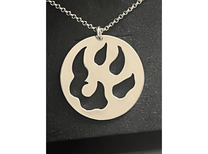 Médaille ajourée Malabar Manufacture patte de chien en argent massif