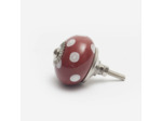 Bouton en céramique rouge à pois blancs